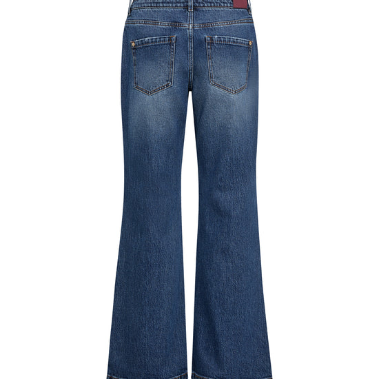 Back view of a pair of blue denim flare jeans on a white background.
