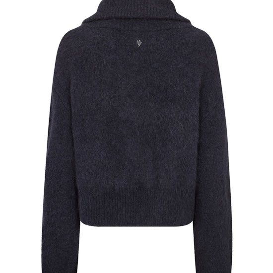 A dark navy blue knit sweater with a high ribbed mock neck collar, shown from the back on a plain white background.