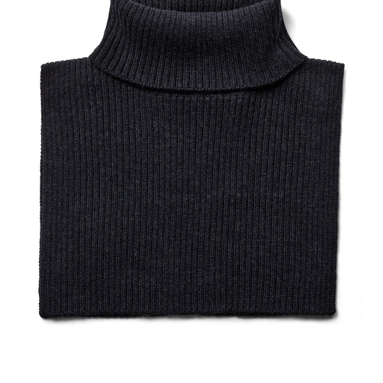 A folded navy ribbed knit turtleneck scarf on a plain white background.