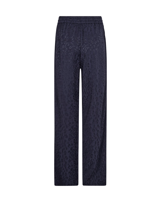A pair of dark navy wide-leg trousers with a subtle textured jacquard pattern, shown flat against a solid white background.