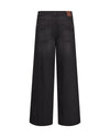 Black wide-leg denim jeans shown from the back, featuring a brown leather patch on the back waistband, photographed against a solid white background.