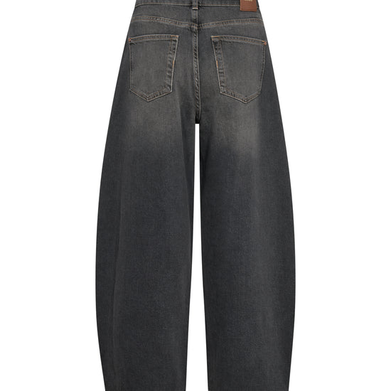 Back view of dark gray wide-leg denim jeans with a brown leather patch on the waistband, shown on a plain white background.