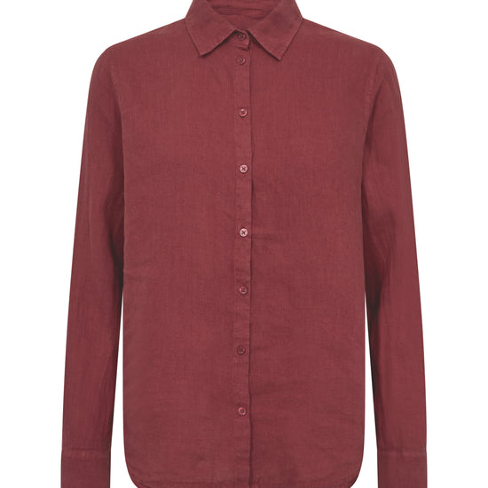 Flat lay of a red linen shirt on a white background