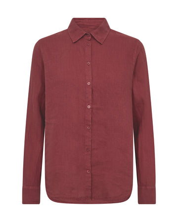 Flat lay of a red linen shirt on a white background