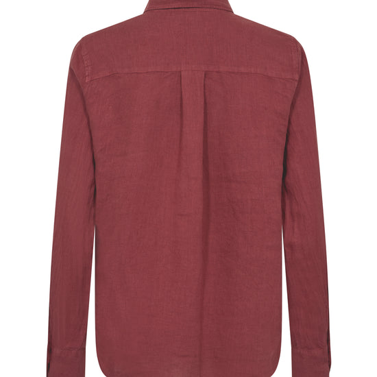 flat lay of a red linen shirt from behind on a white background