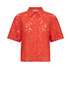Orange lace floral patterned shirt on a white background