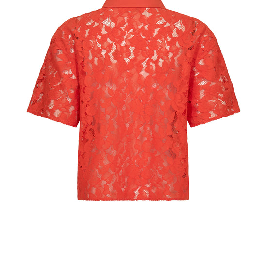 orange lace shirt on a white background