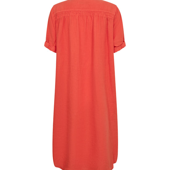 Orange linen dress on a white background