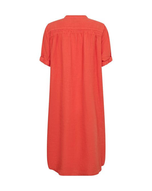 Orange linen dress on a white background
