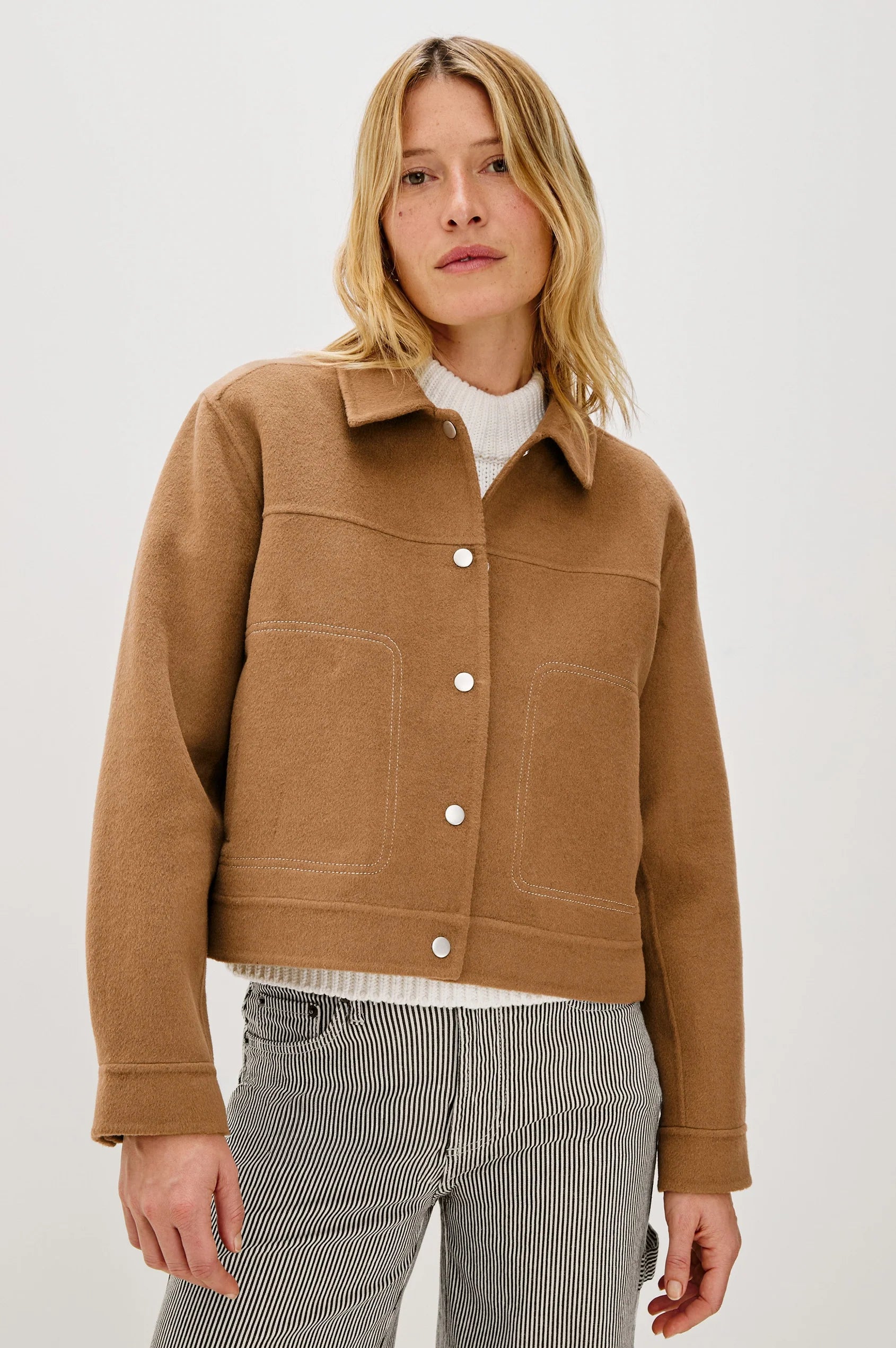 camel short jacket with collar, white stitch detailing and boxy fit