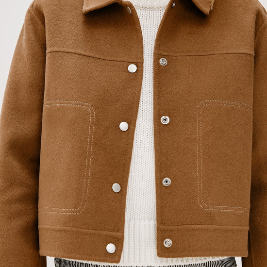 camel short jacket with collar, white stitch detailing and boxy fit close up
