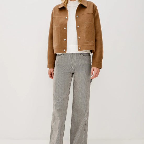 camel short jacket with collar, white stitch detailing and boxy fit model shot