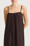Brown slip dress with thin straps on a white background