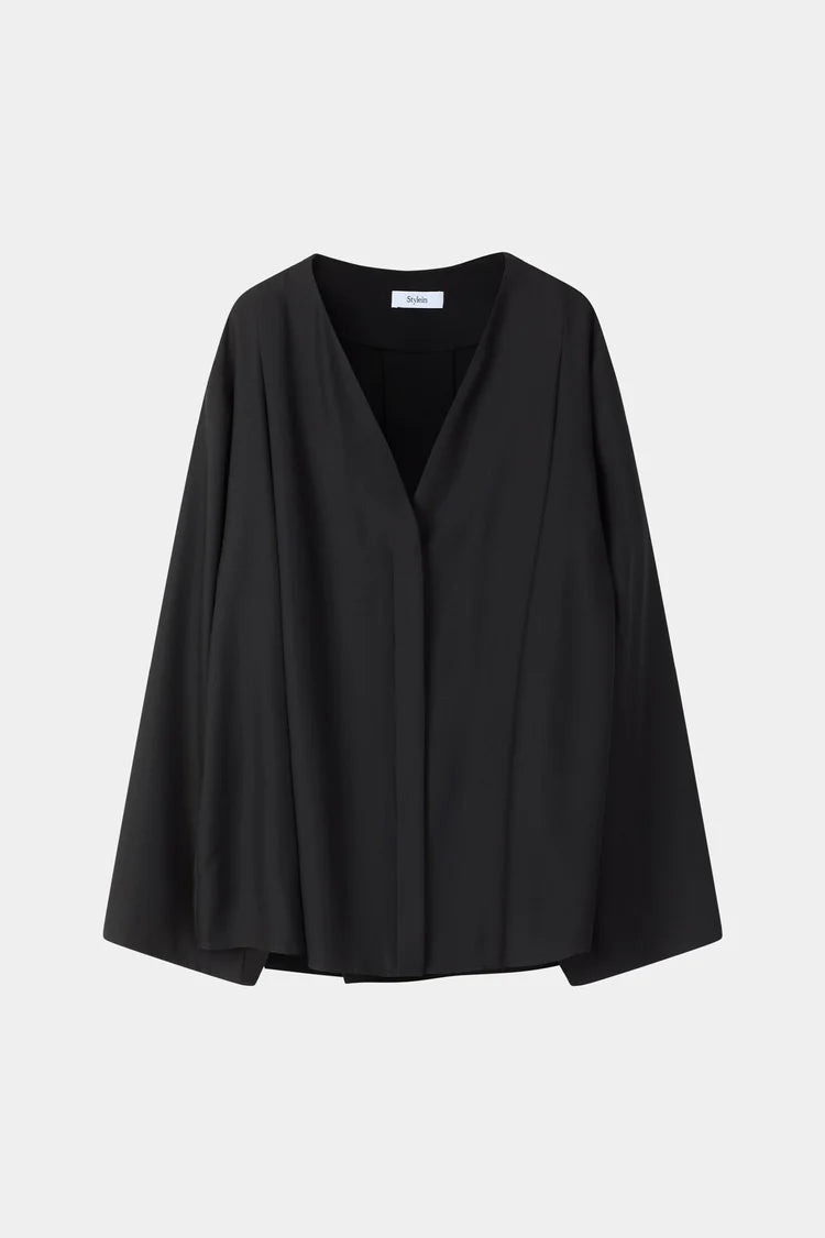 A black draped wrap jacket with wide, flowing sleeves and a V-neckline, displayed against a light gray background.