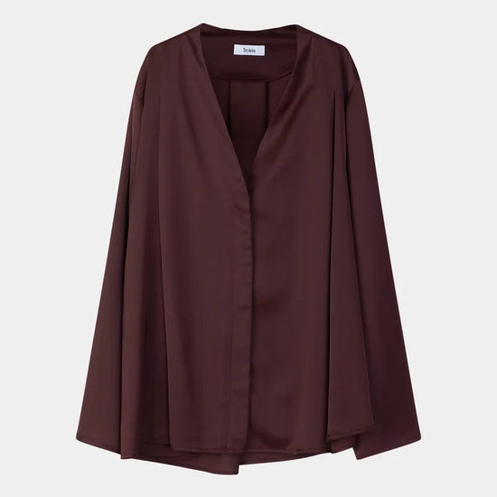 A dark brown, long-sleeved draped wrap jacket with a V-neckline, displayed on a neutral light gray background.