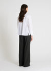 white shirt with concealed placket and pleated rear, rear view