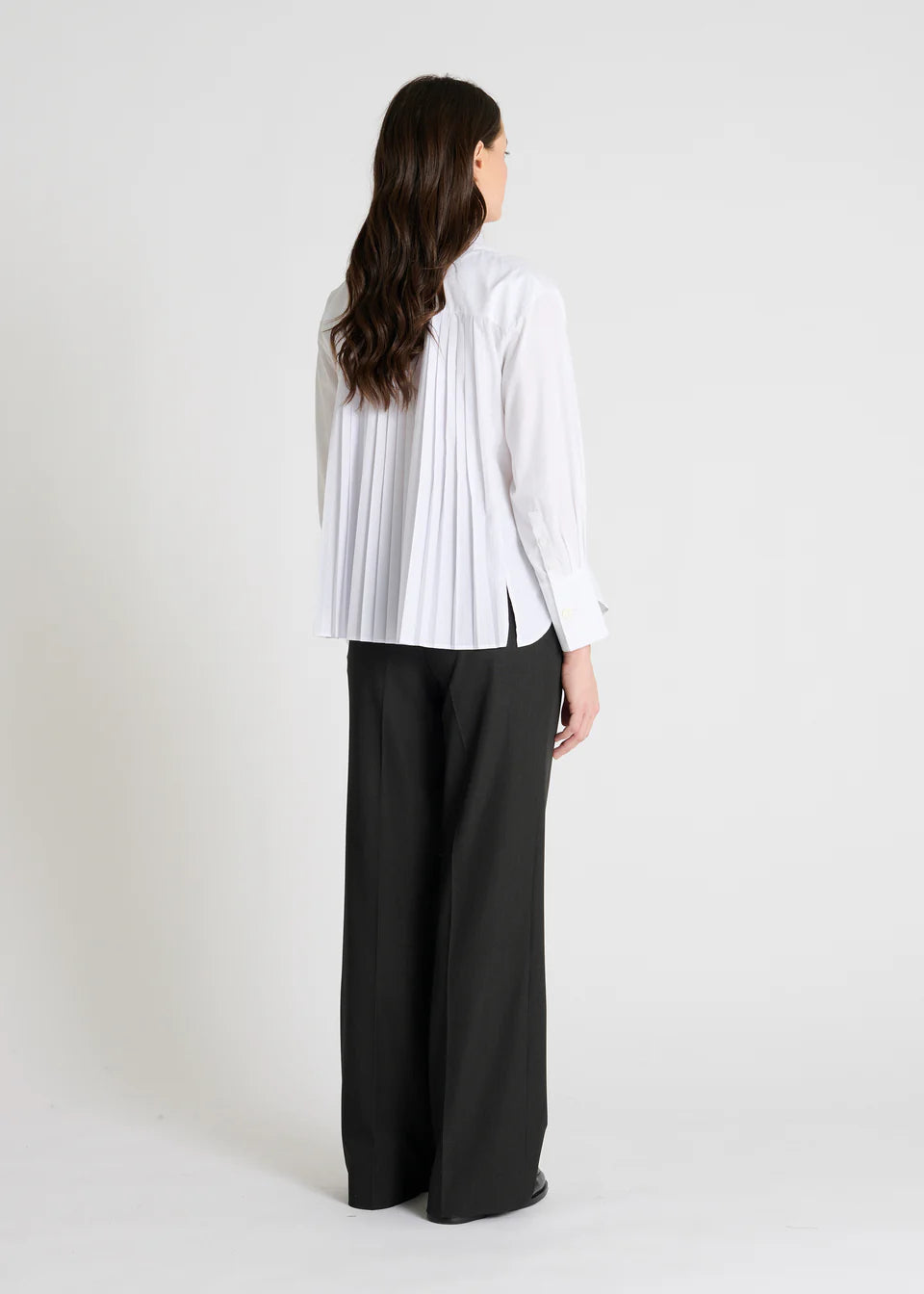 white shirt with concealed placket and pleated rear, rear view