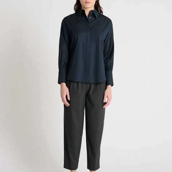 dark navy shirt with concealed placket and pleated rear