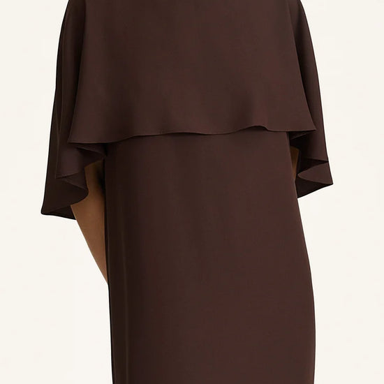Brown dress with a layered design on a white background