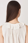 sleeveless white top with v neck and tie up strings 