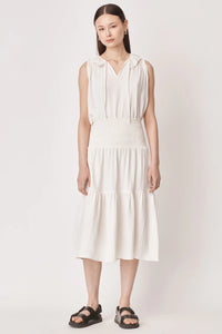 sleeveless white top with v neck and tie up strings 