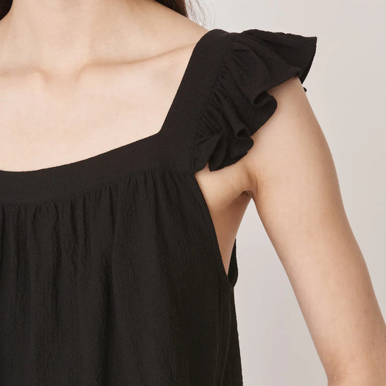 Ruffle capped sleeved top with square neck and backline in textured waffle like black fabricv