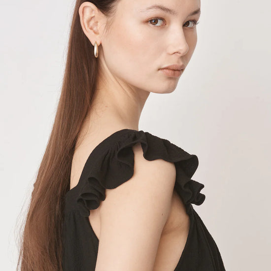 Ruffle capped sleeved top with square neck and backline in textured waffle like black fabric