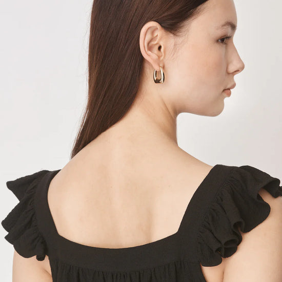 Ruffle capped sleeved top with square neck and backline in textured waffle like black fabric