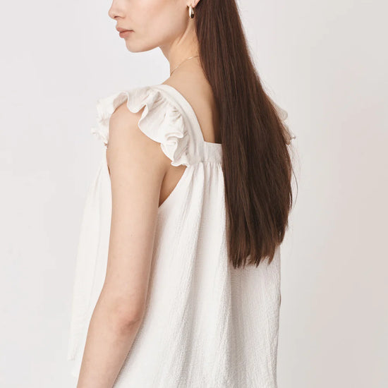 Ruffle capped sleeved top with square neck and backline in textured waffle like white ecru fabric