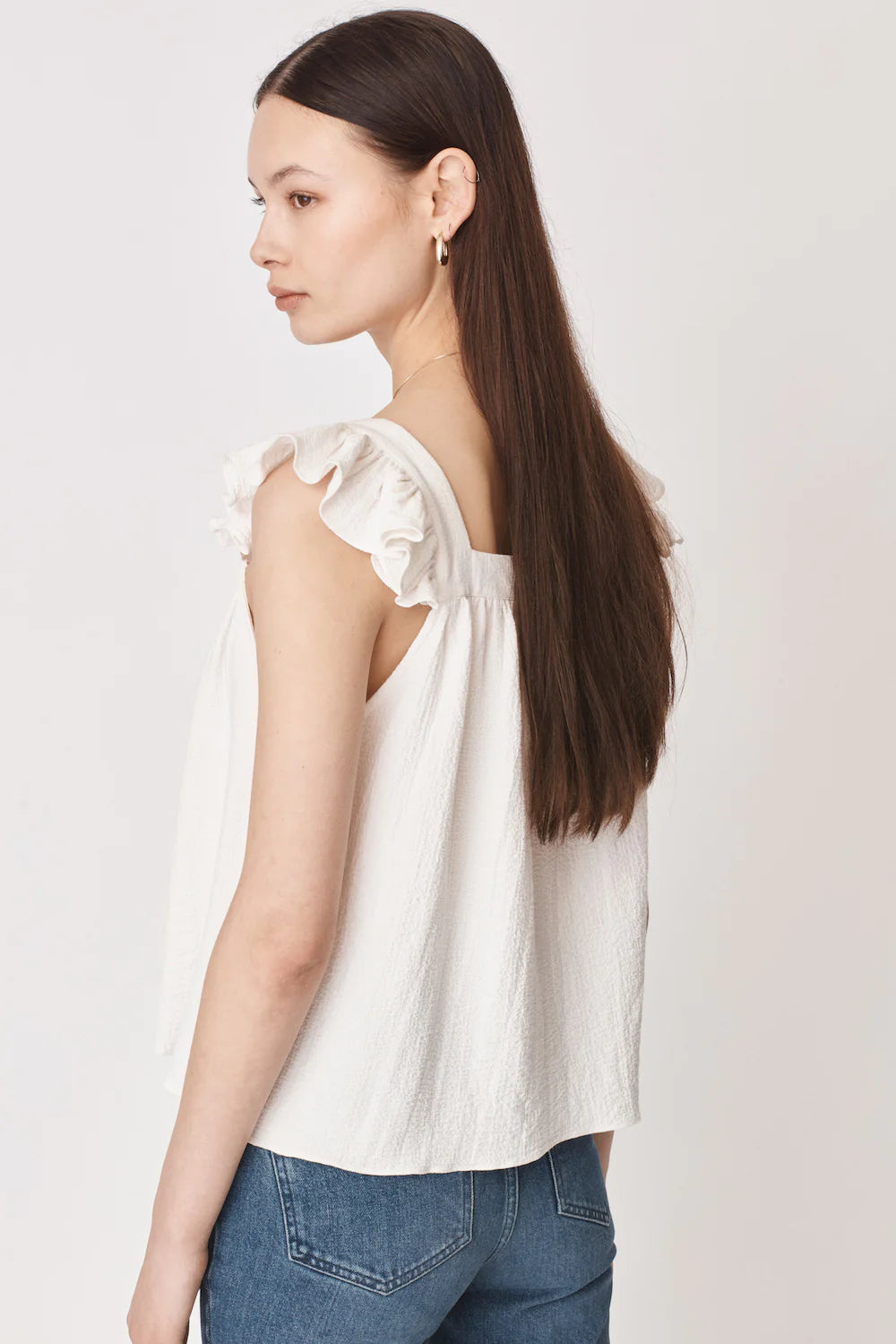 Ruffle capped sleeved top with square neck and backline in textured waffle like white ecru fabric