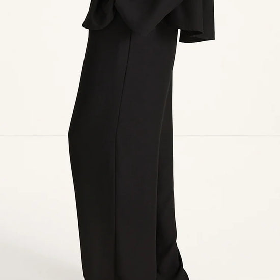 Black outfit with wide-leg pants on a white background