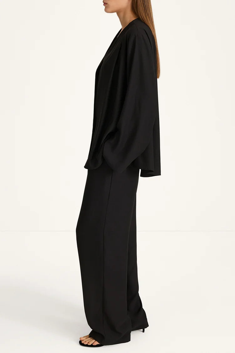 Woman wearing a black outfit on a white background