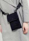 person modelling a black side bag