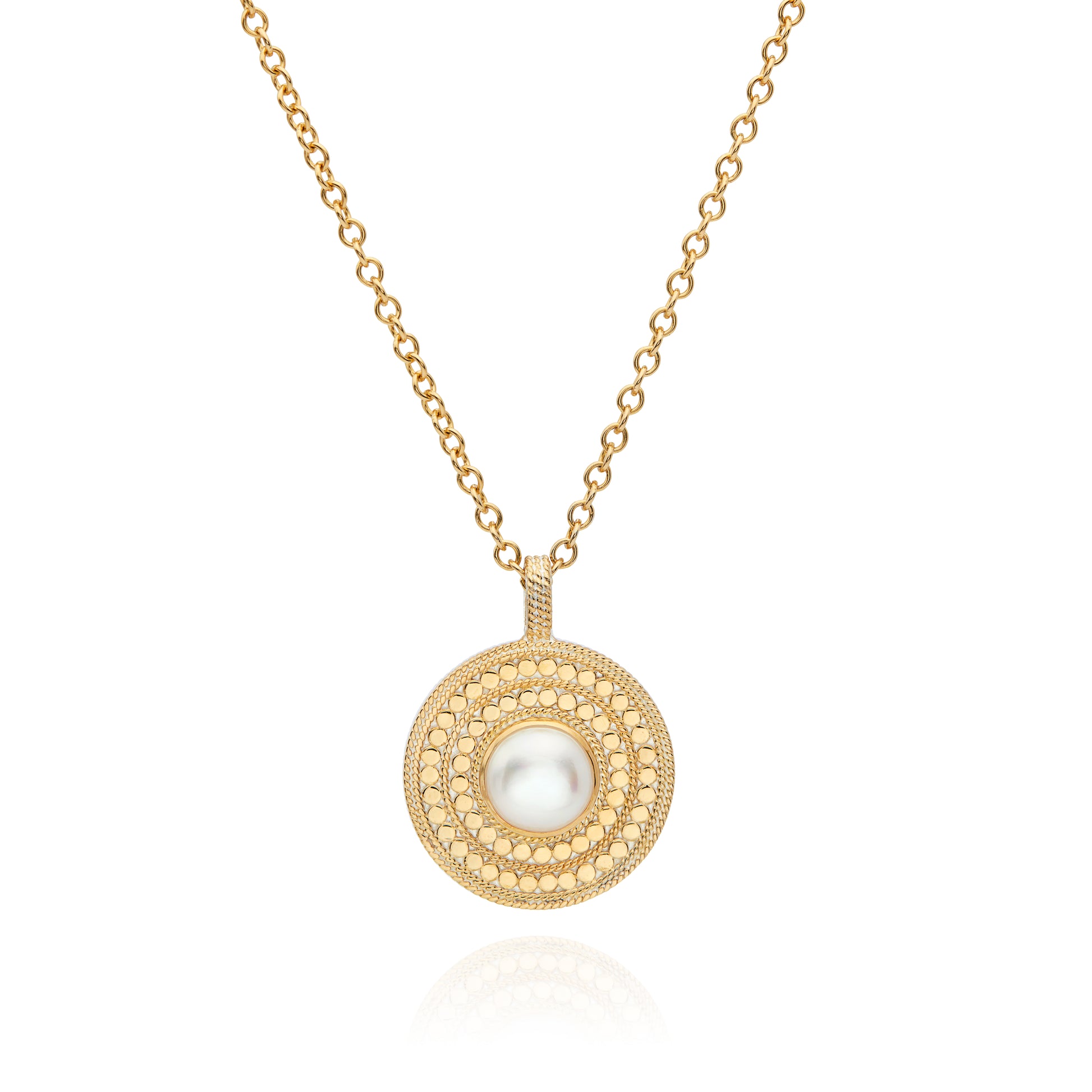 gold disc pendant necklace with dot detailing and white pearl in centre on a small gold chain and a lobster clasp from anna beck 