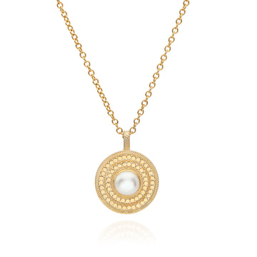 gold disc pendant necklace with dot detailing and white pearl in centre on a small gold chain and a lobster clasp from anna beck 