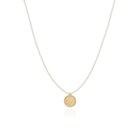 Seed pearl necklace with gold circular charm