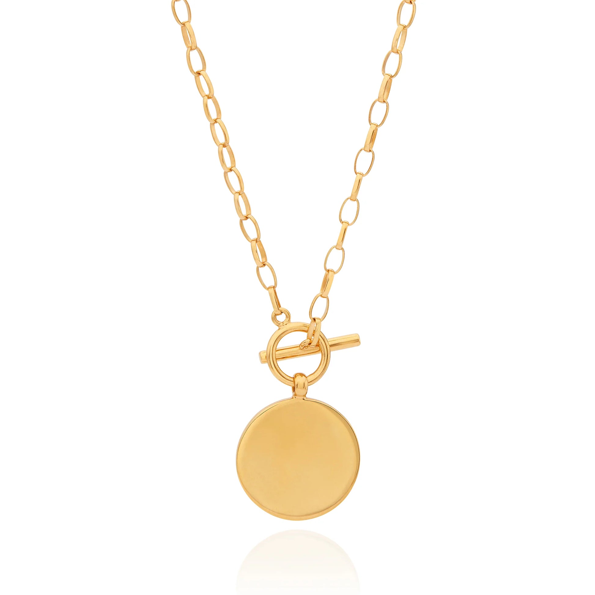 Gold necklace with toggle fastening and coin shaped pendant featuring dot work