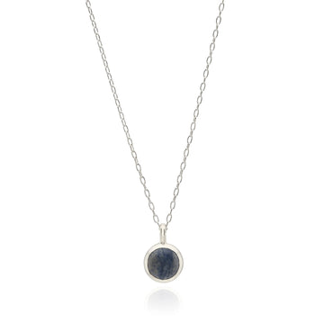 Sterling silver circular pendant necklace with blue stone and dot work