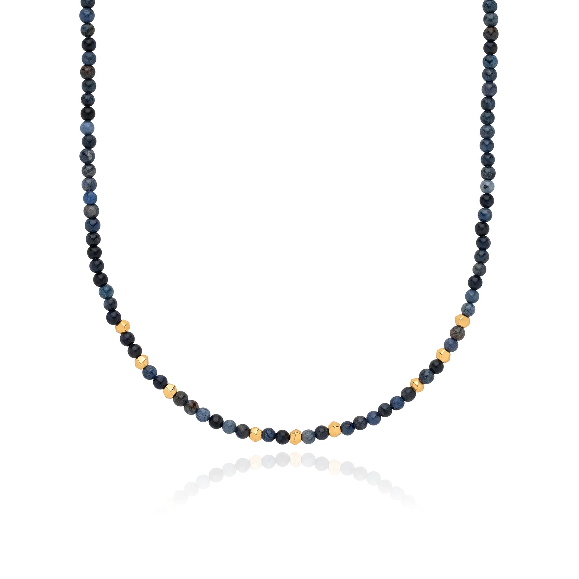 Close up of blue and gold beaded necklace