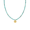 turquoise beaded necklave with gold plated charm