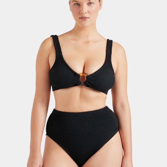 black crinkle bikini with hoop at the bust and high rise bottoms from hunza g model shot