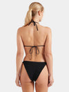 Woman wearing a black Hunza G bikini on a white background rear view