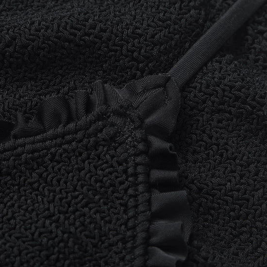 Close-up of a textured black fabric from a Hunza G bikini