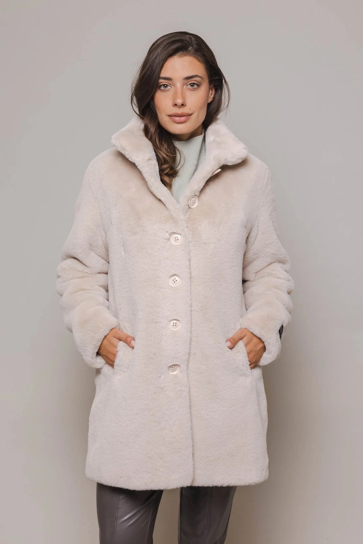 Stone coloured midi length faux fur coat with classic collar and button fastening