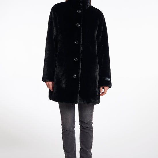 faux fur coat with high neck, black buttons and length just above the knee 