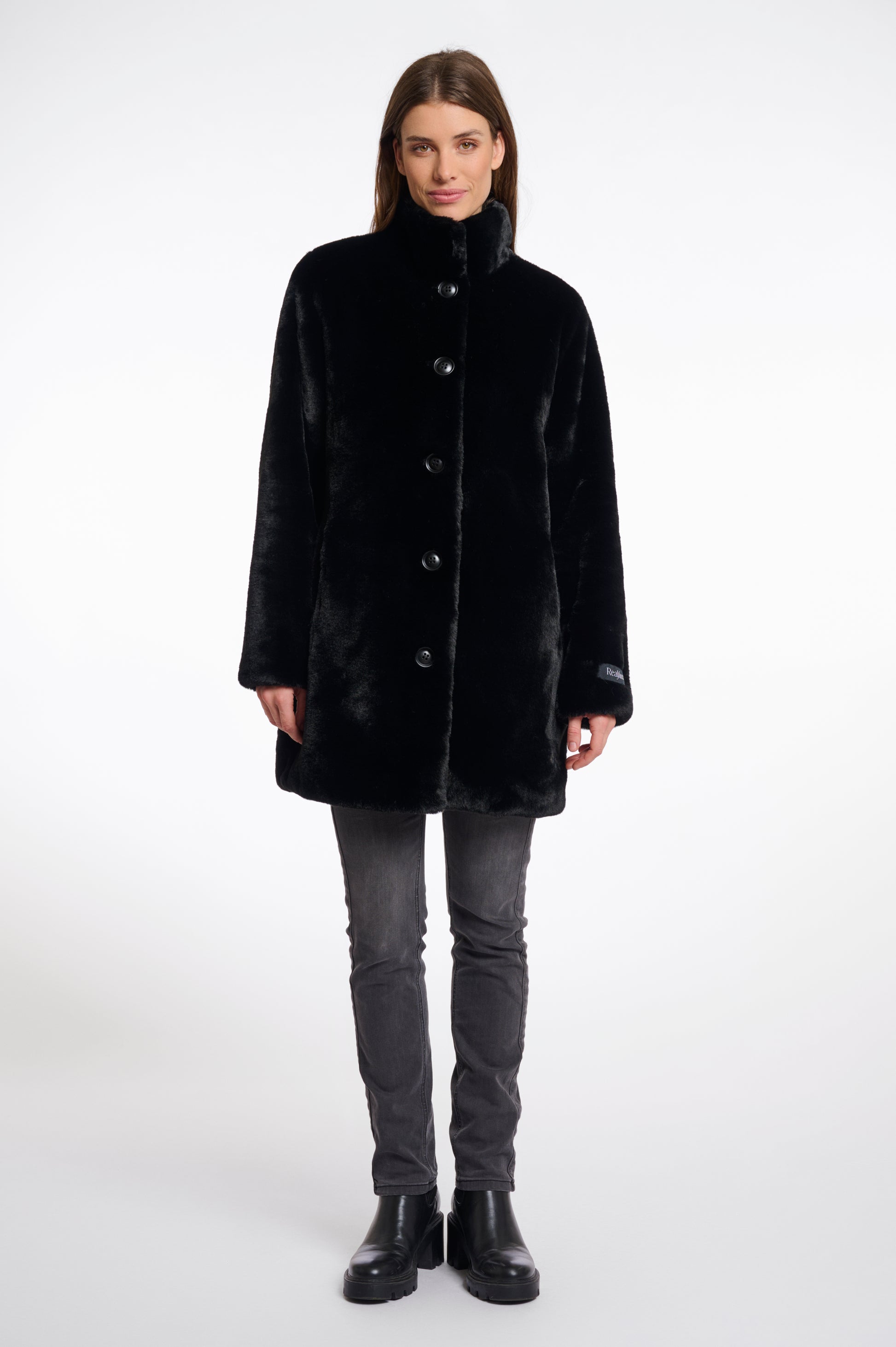 faux fur coat with high neck, black buttons and length just above the knee 