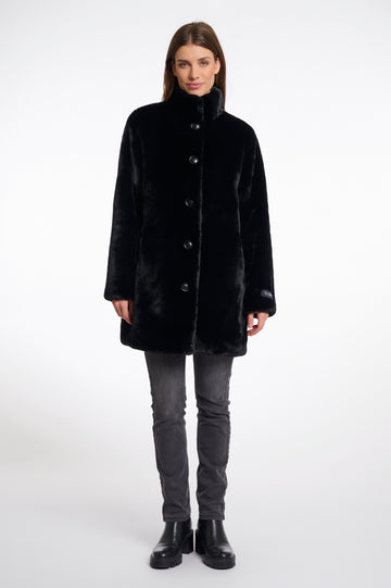 faux fur coat with high neck, black buttons and length just above the knee 