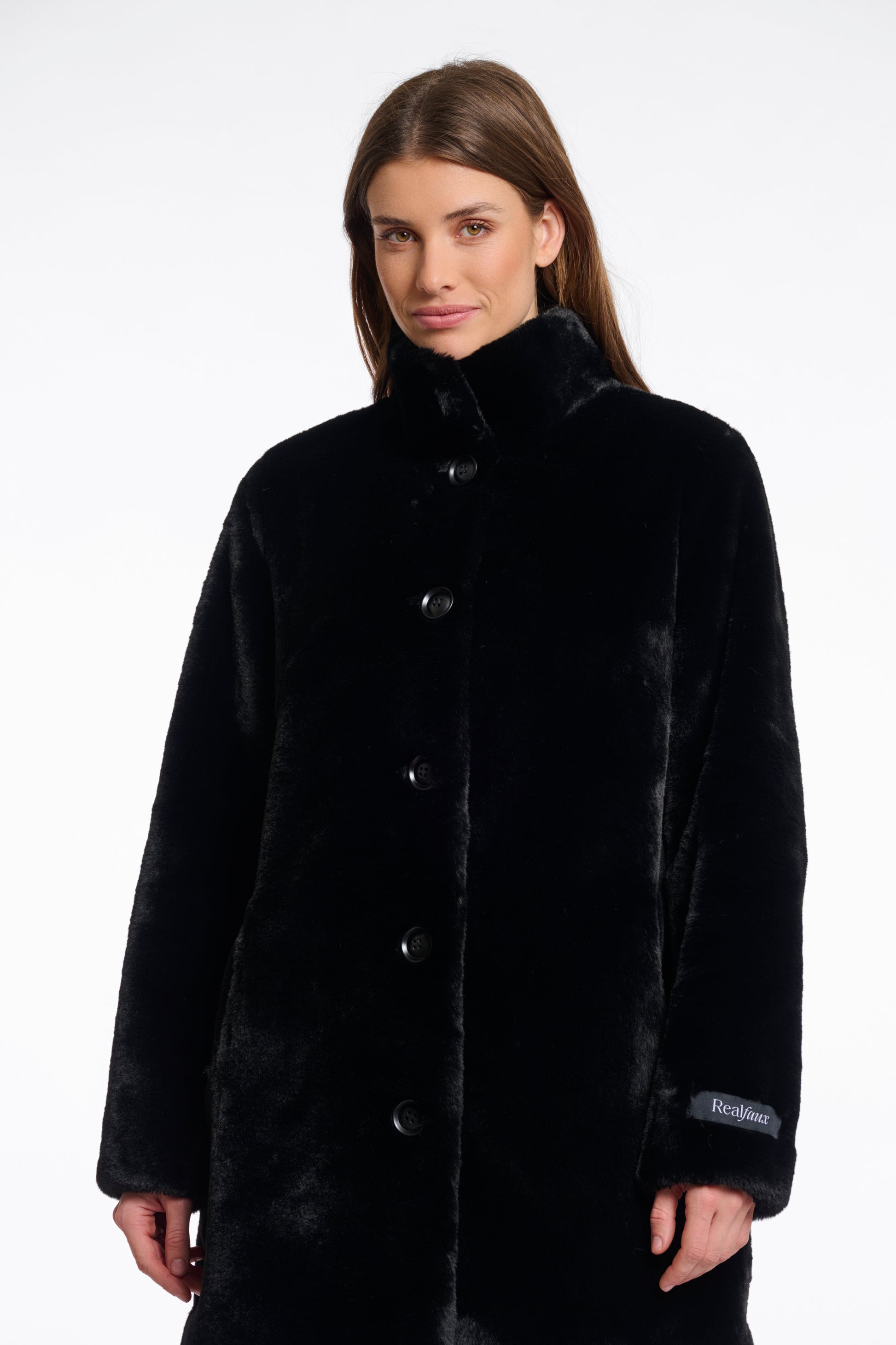 faux fur coat with high neck, black buttons and length just above the knee  close up