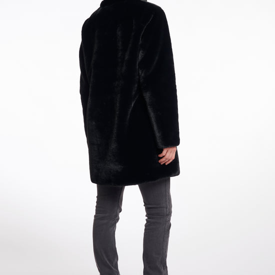 faux fur coat with high neck, black buttons and length just above the knee  rear view 