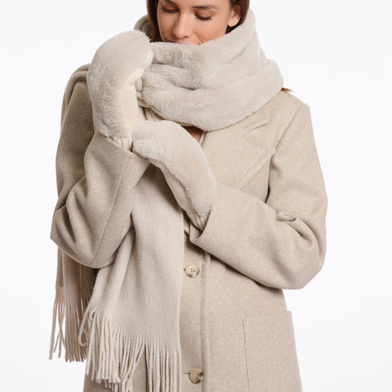 beige knitted mittens with faux fur on top side model shot